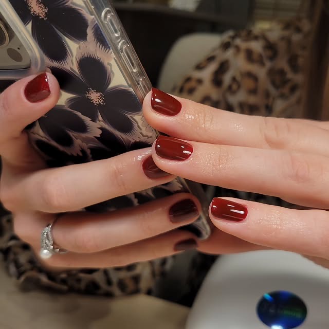 Abstract dark floral nail art, close-up detail